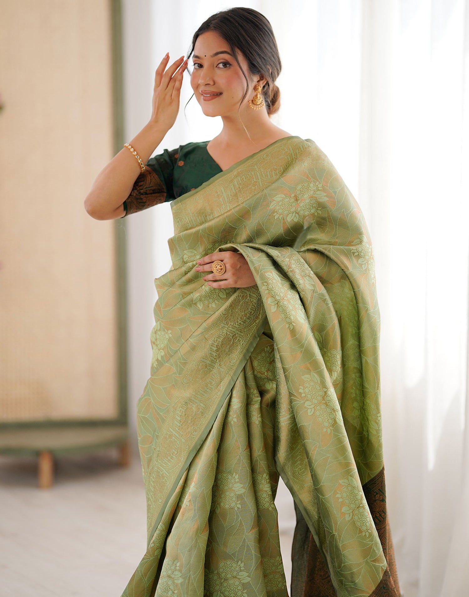 Pista Green Silk Woven Saree