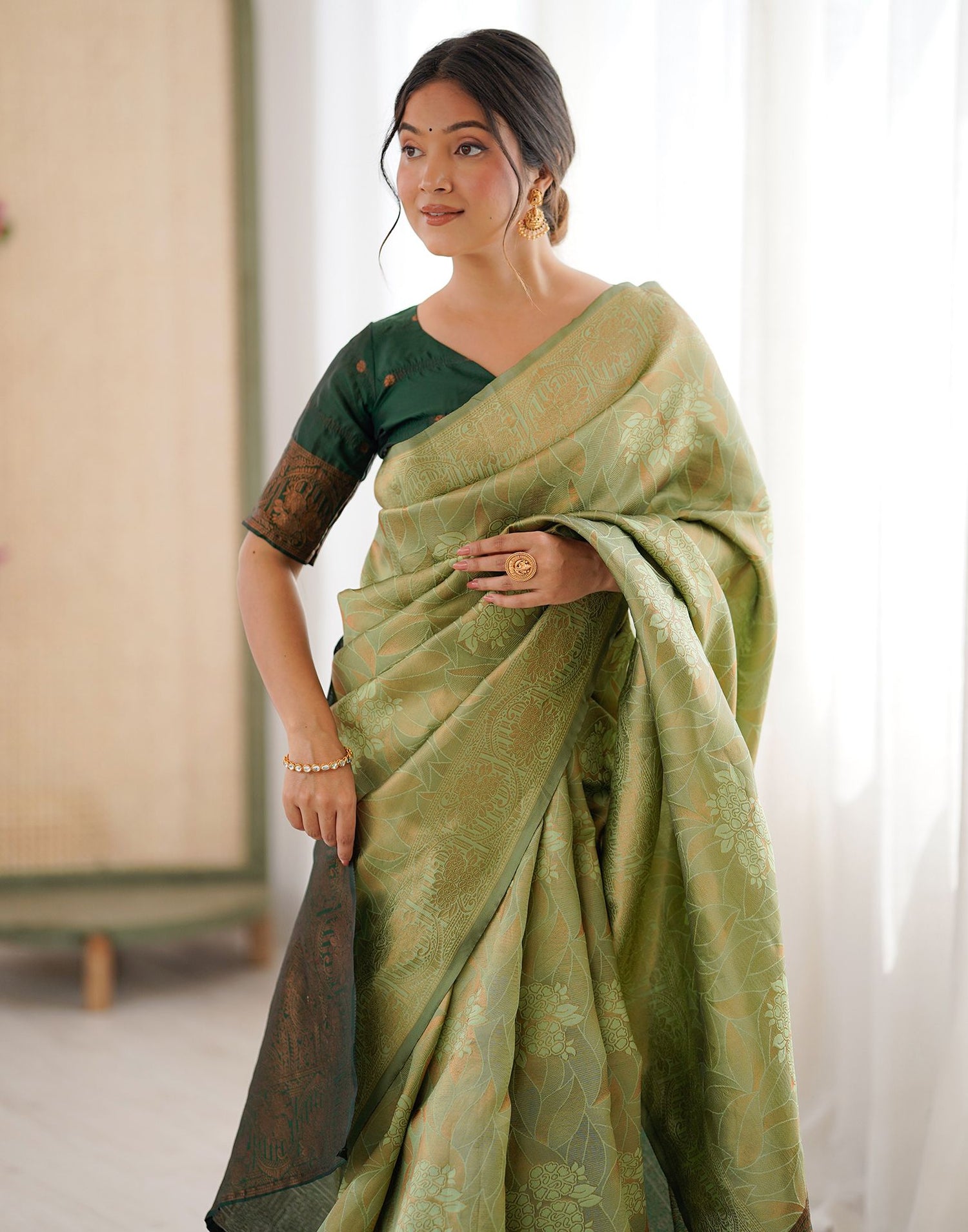Pista Green Silk Woven Saree