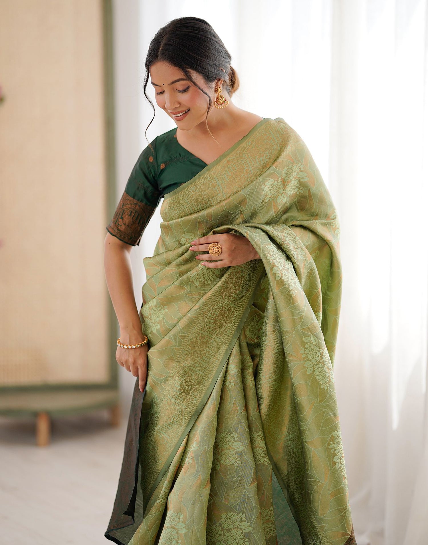 Pista Green Silk Woven Saree