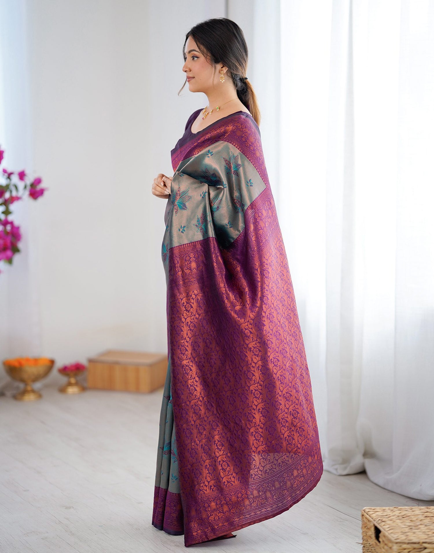 Teal Green Silk Woven Saree