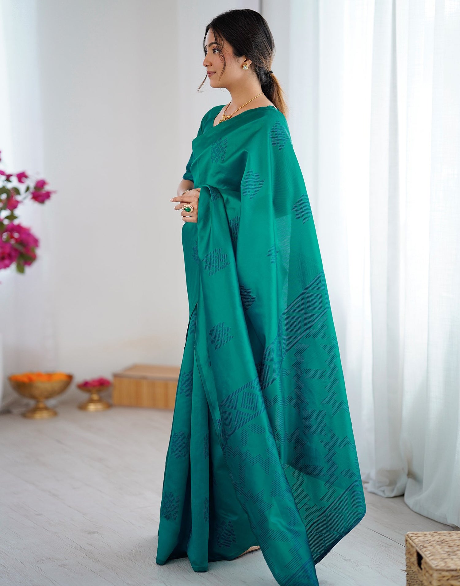 Teal Green Silk Woven Saree