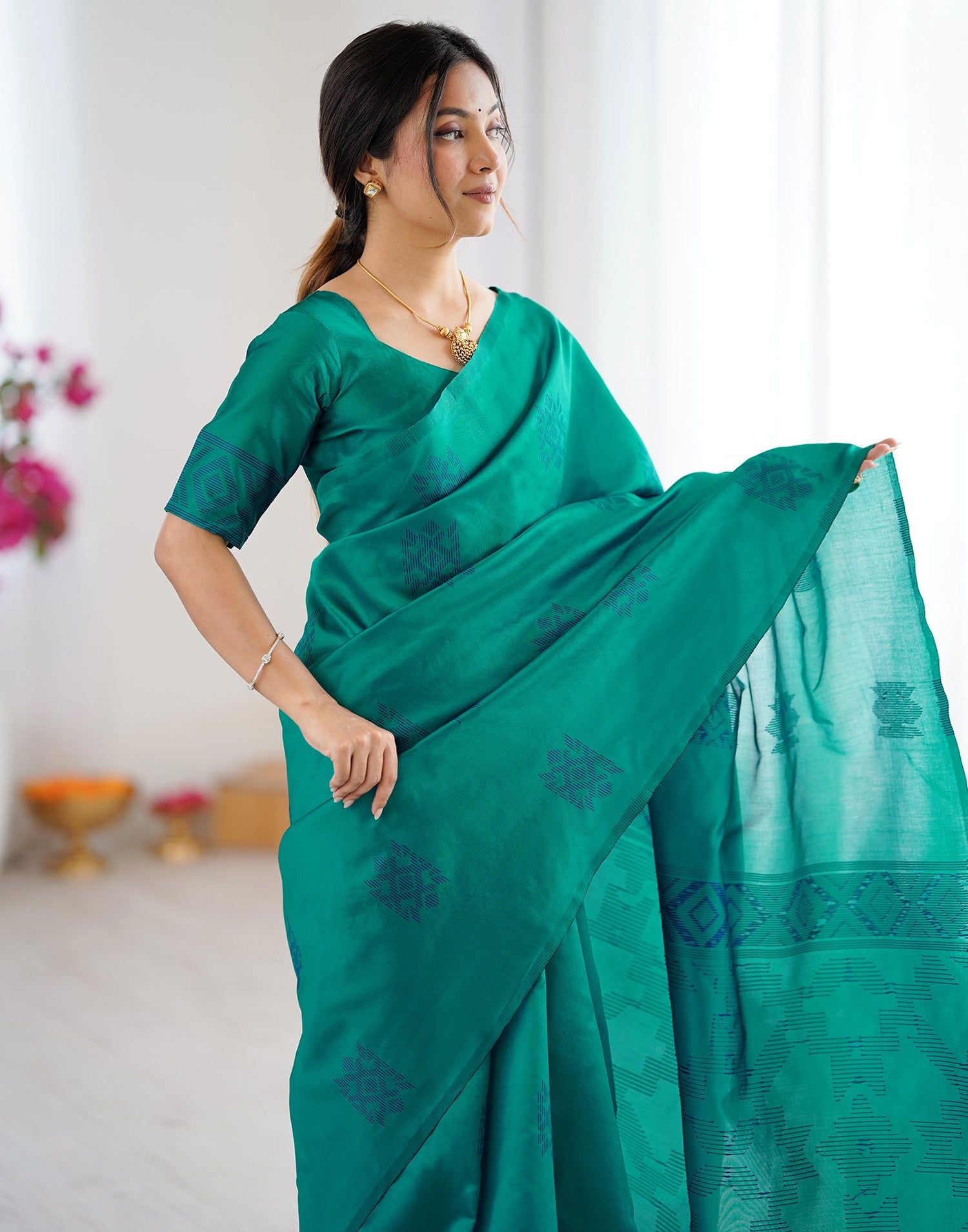 Teal Green Silk Woven Saree