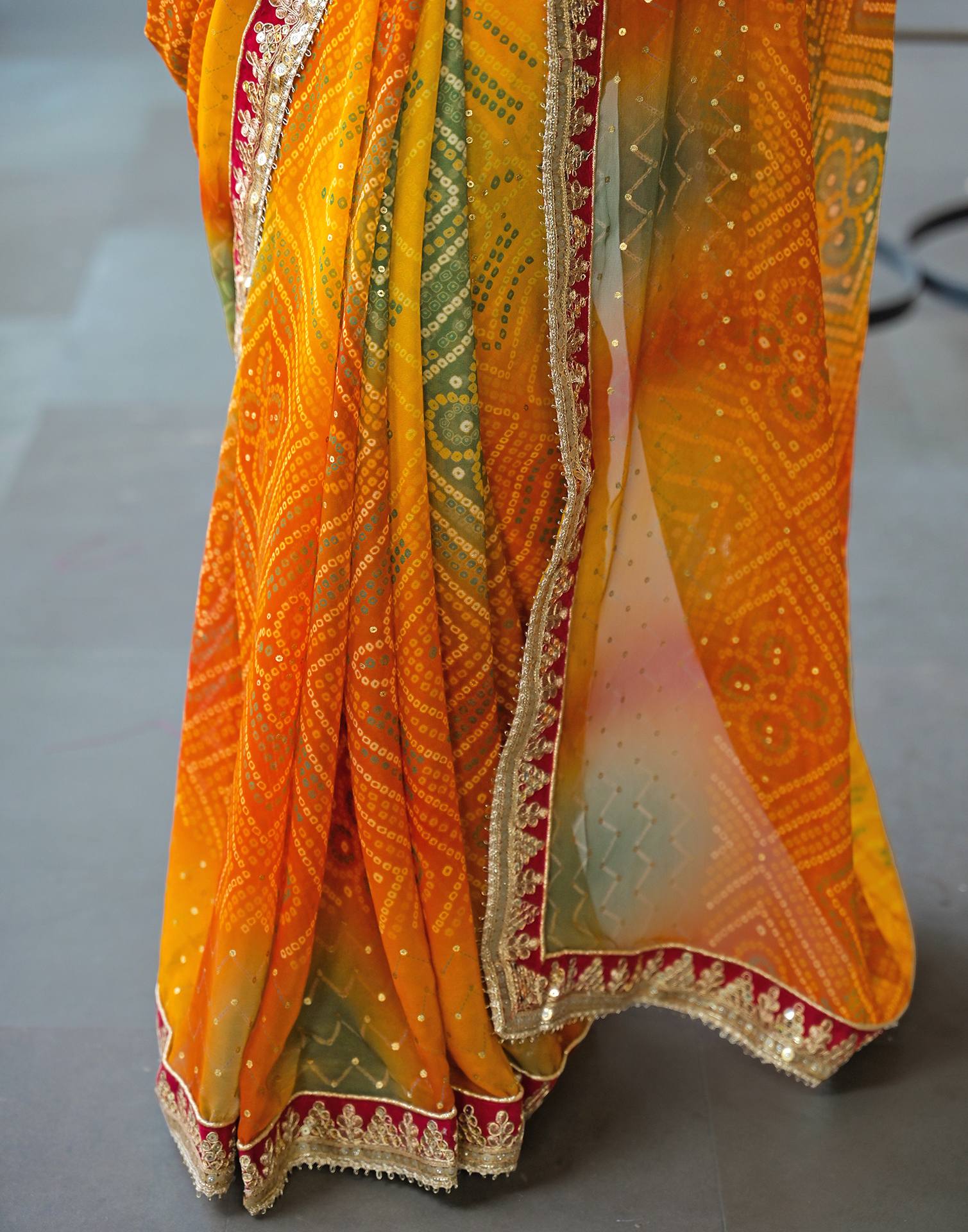 Orange Georgette Bandhani Printed Lace Saree