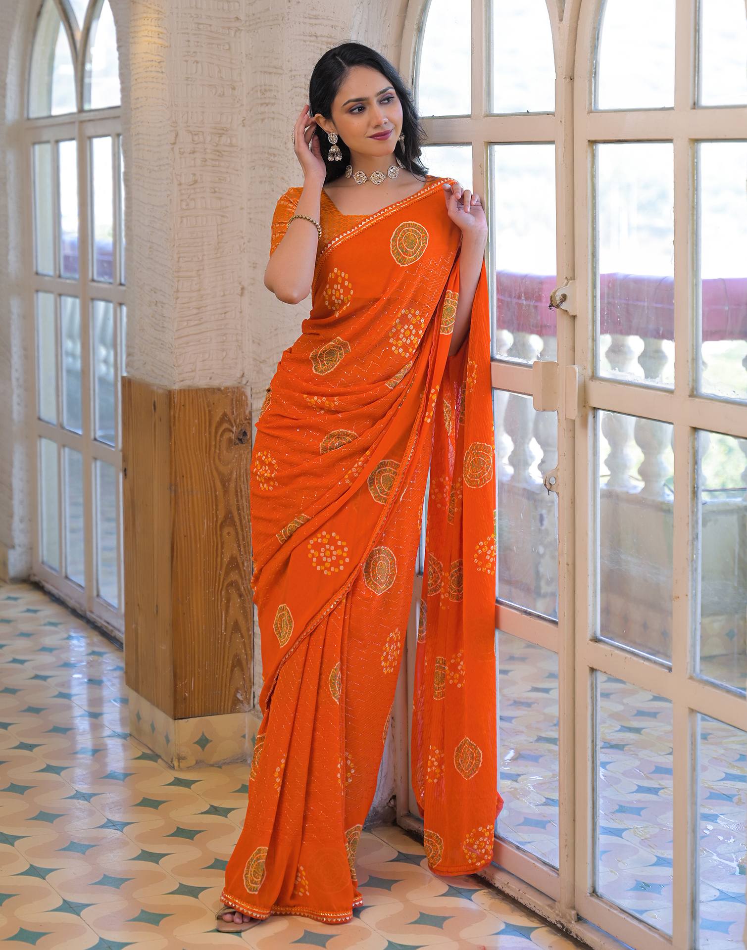Orange Georgette Bandhani Printed Lace Saree