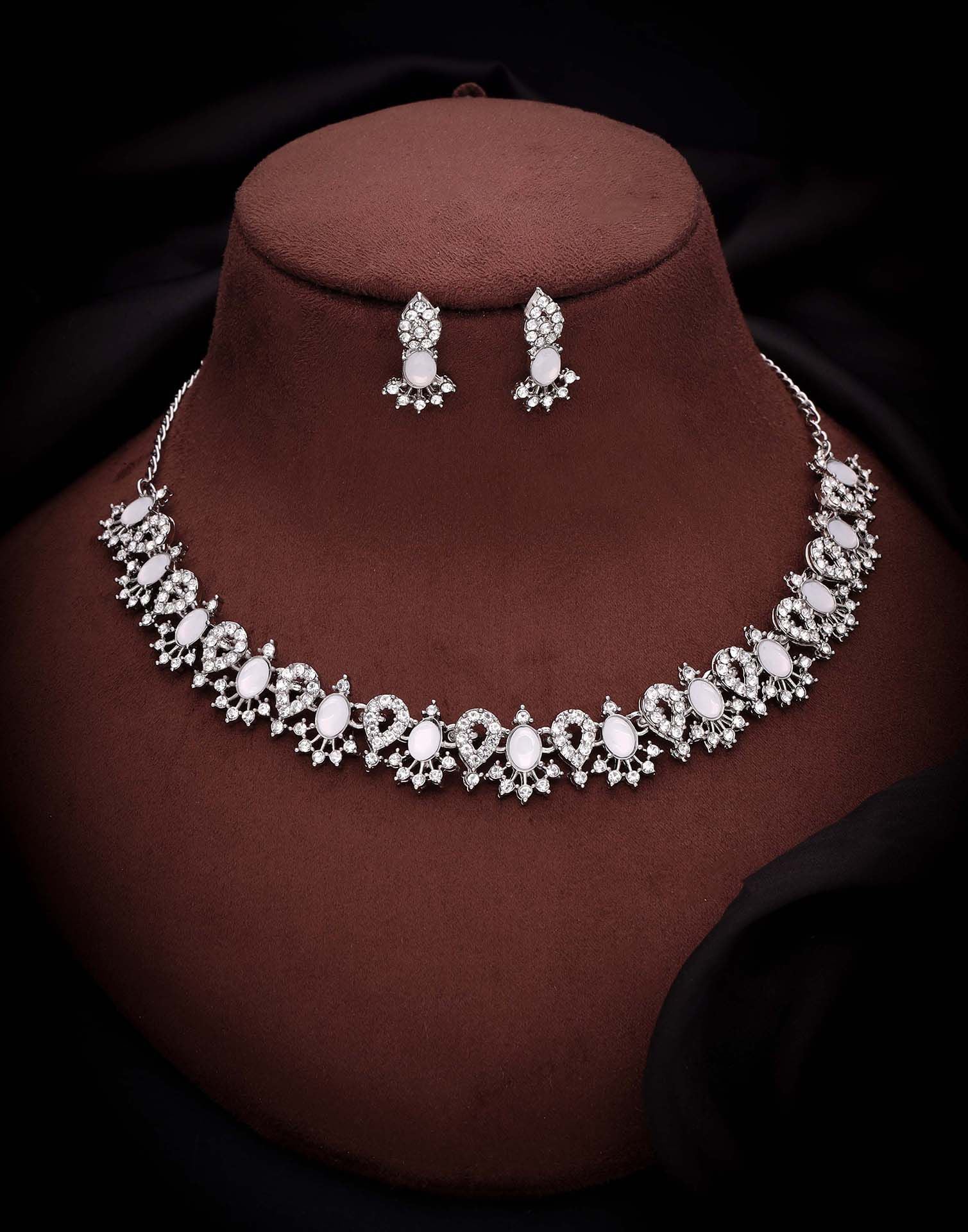 Silver/ store white choker necklace/earrings.