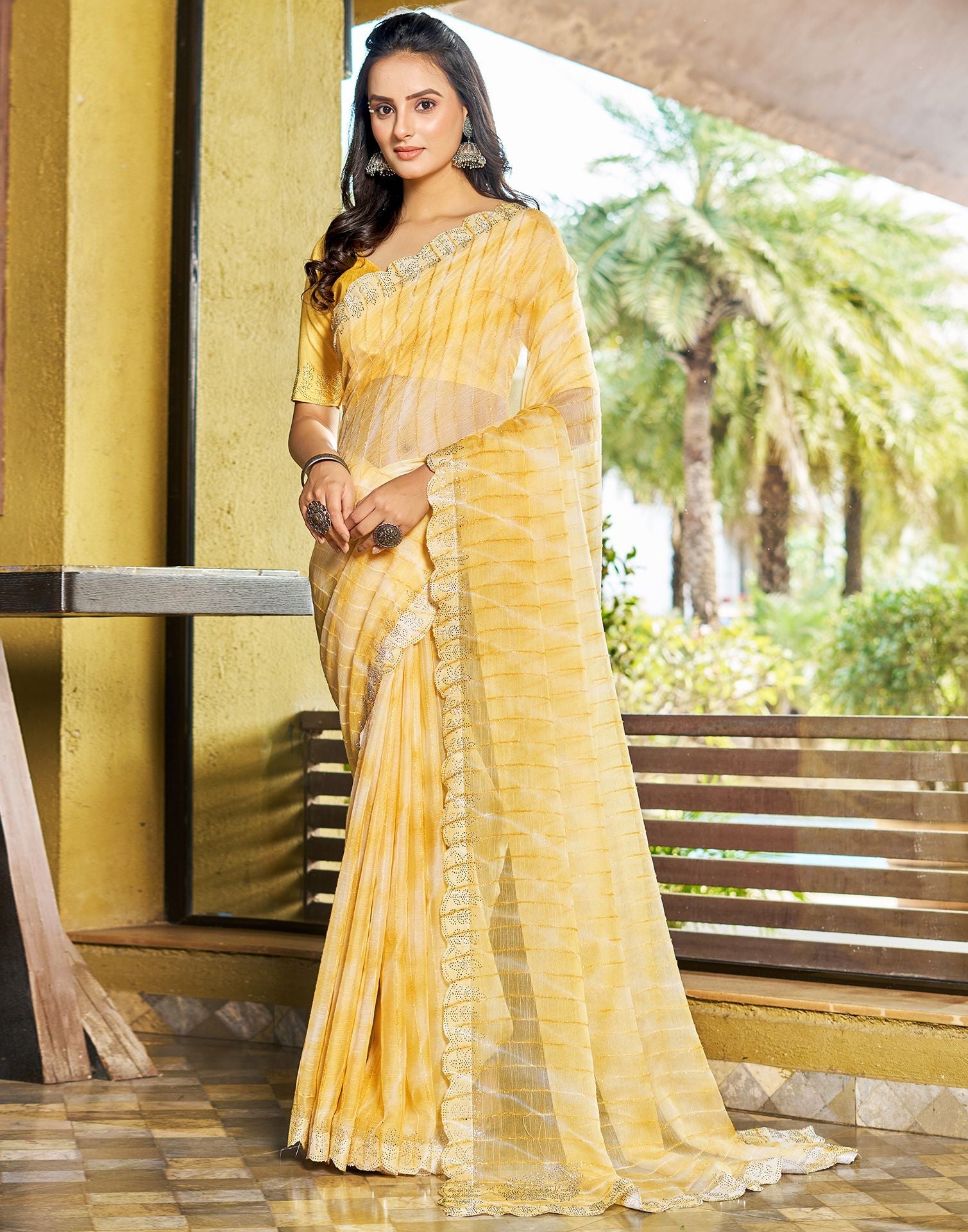 Yellow color Chiffon sarees with all over printed design with silver border  -CHIF0001570