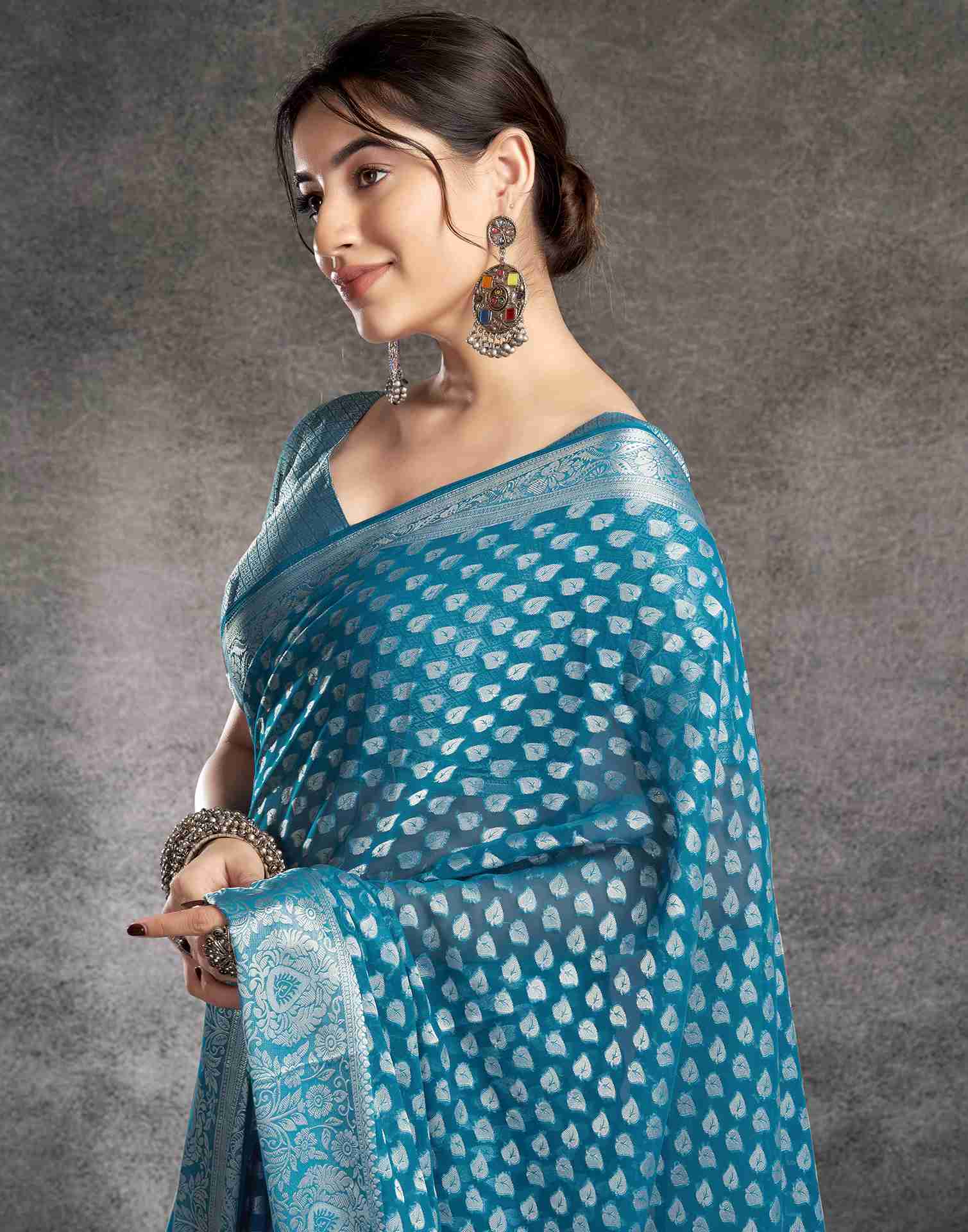 Teal Blue Georgette Woven Foil Printed Saree