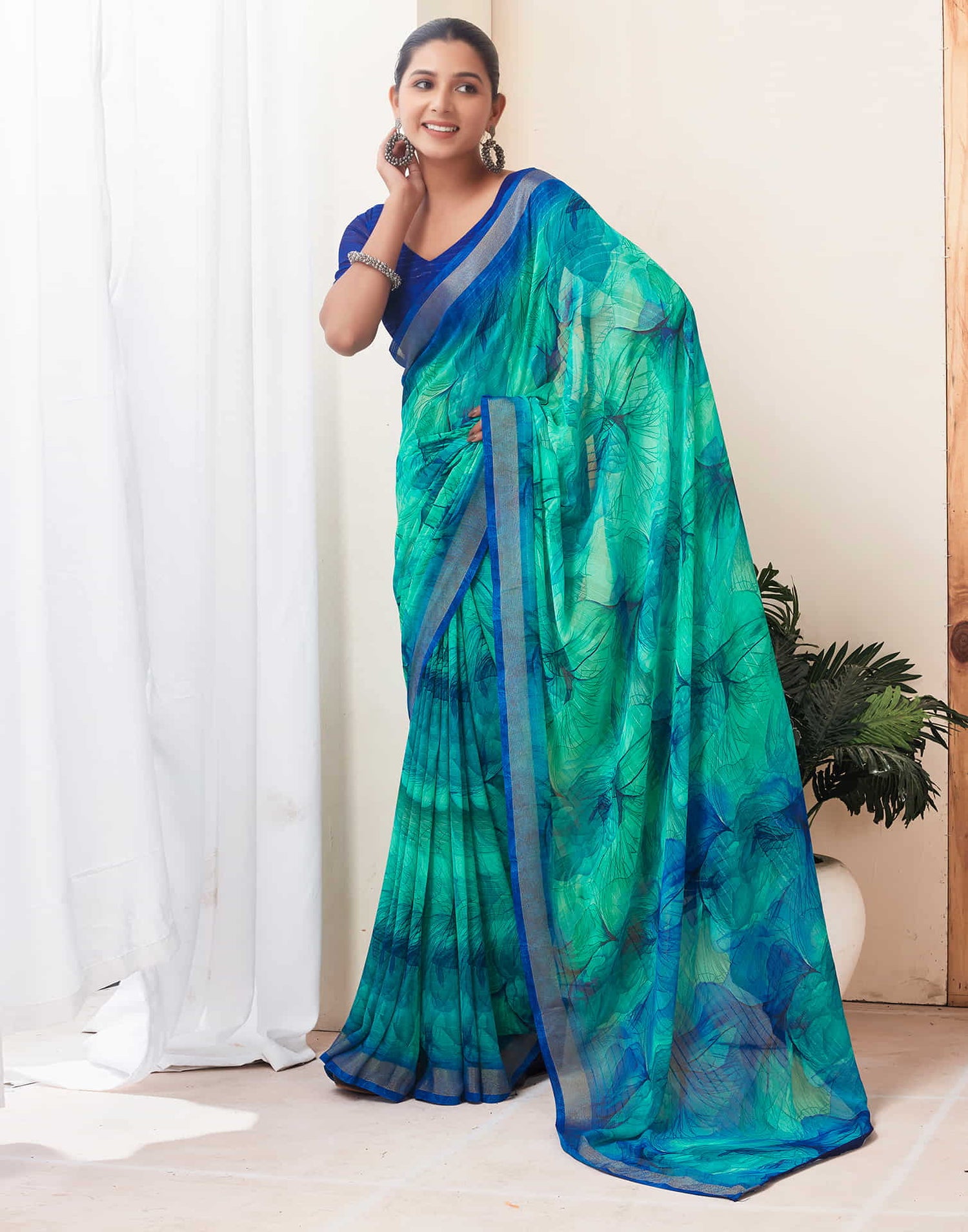 Teal Green Georgette Printed Saree