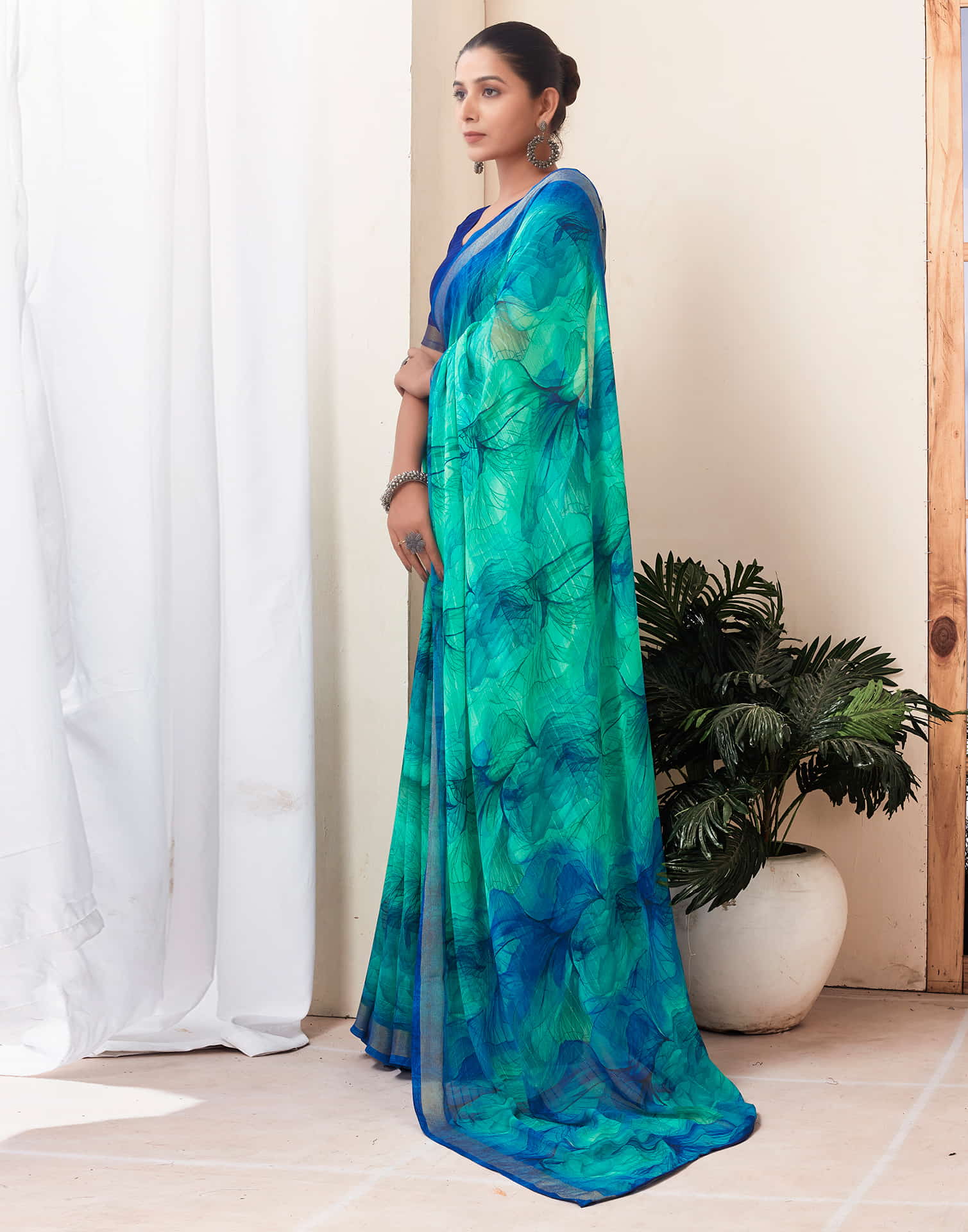 Teal Green Georgette Printed Saree