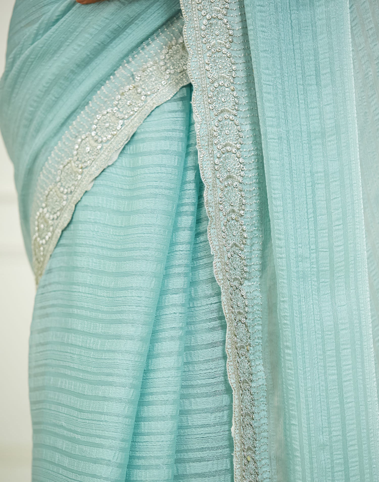 Powder Blue Chiffon Self Woven Embellished Saree