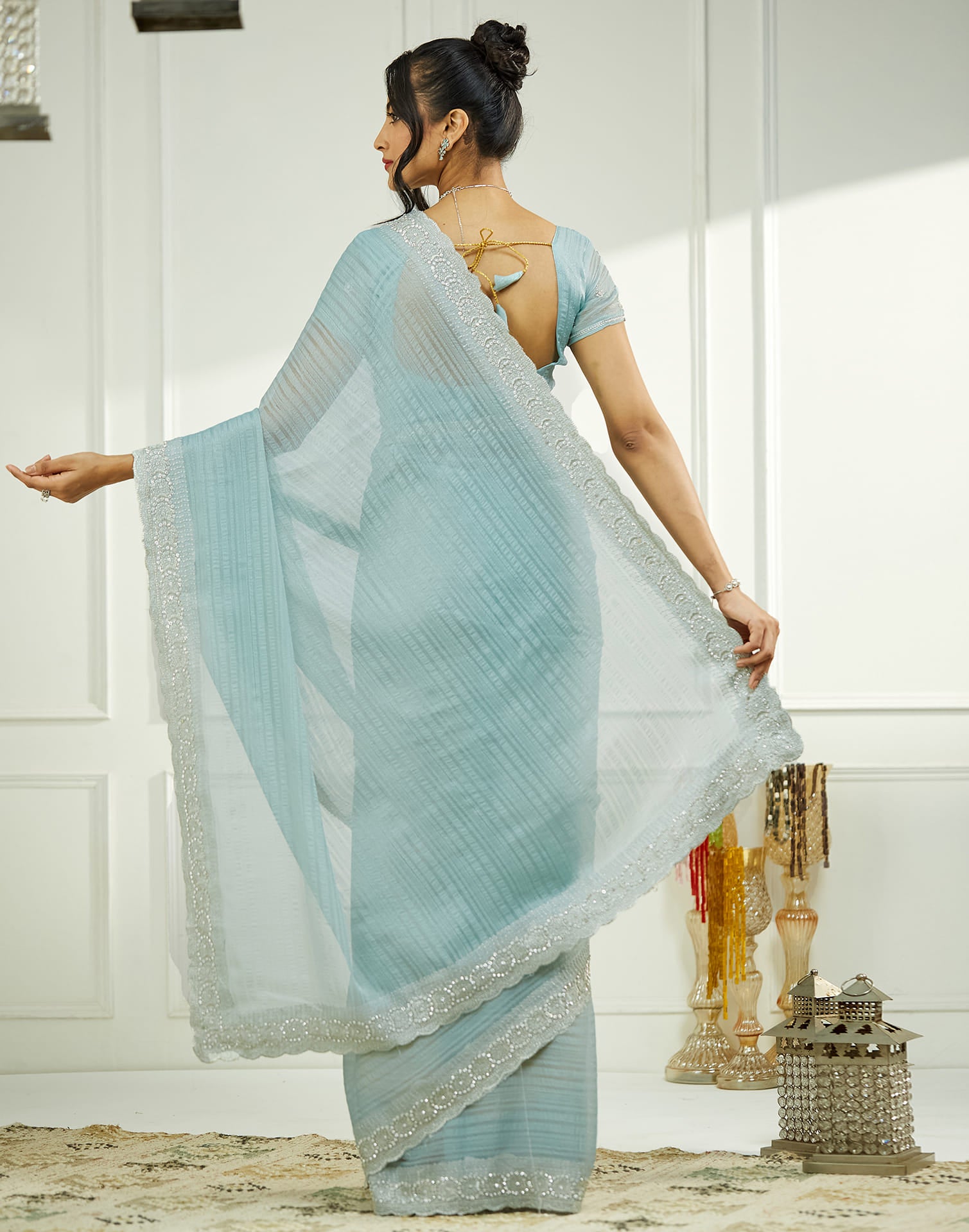 Powder Blue Chiffon Self Woven Embellished Saree