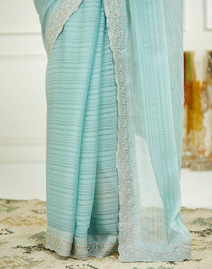 Powder Blue Chiffon Self Woven Embellished Saree