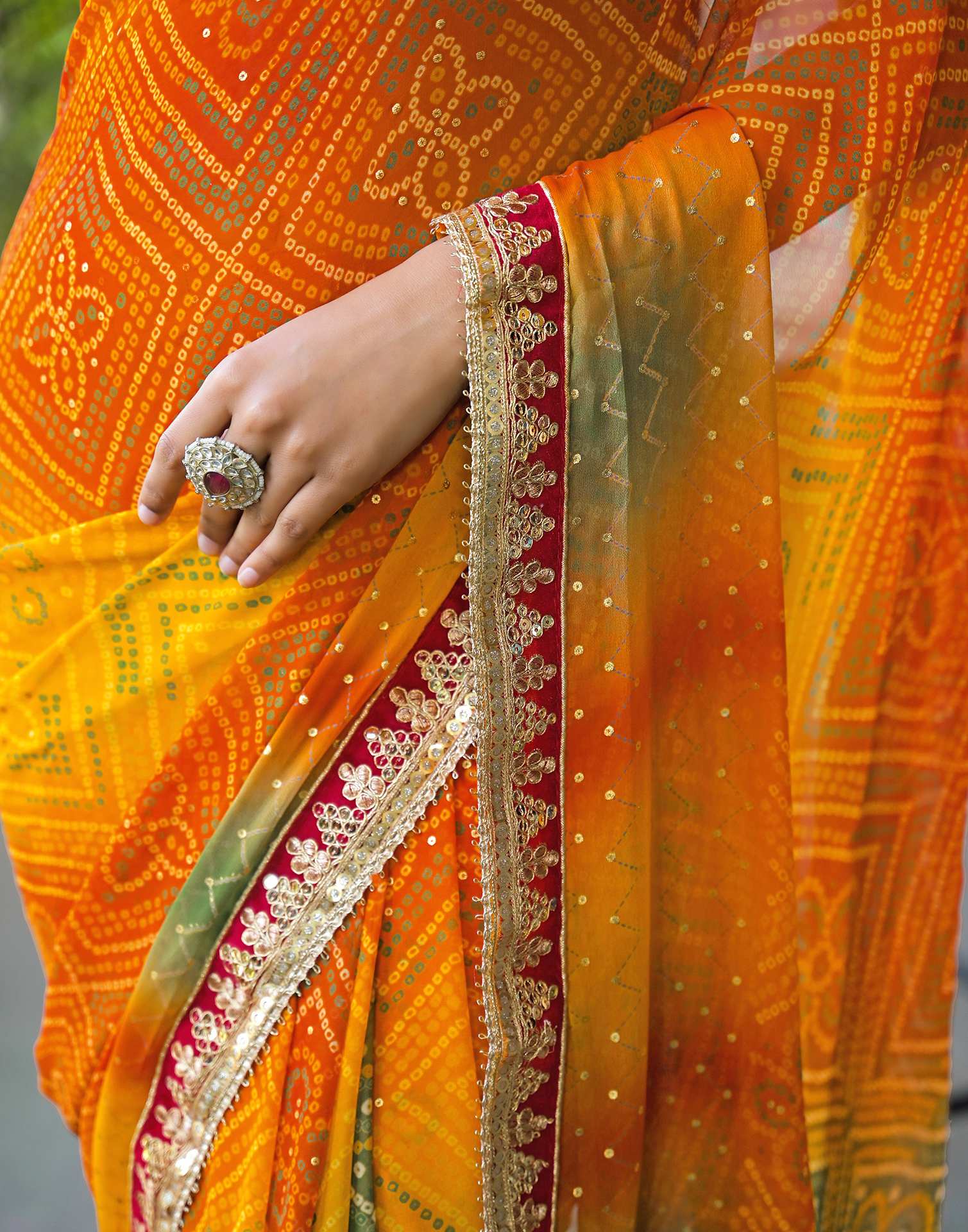 Orange Georgette Bandhani Printed Lace Saree