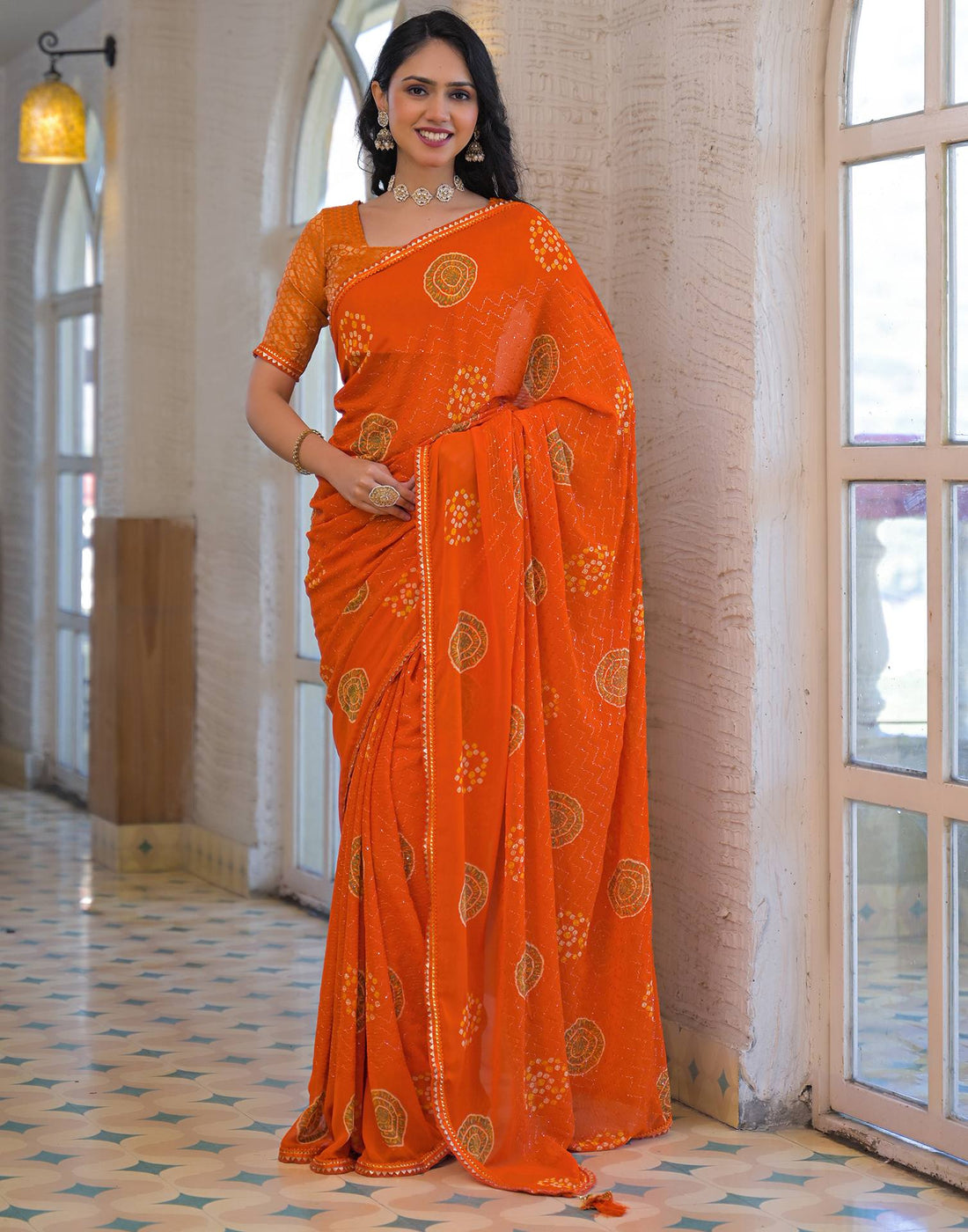 Orange Georgette Bandhani Printed Lace Saree