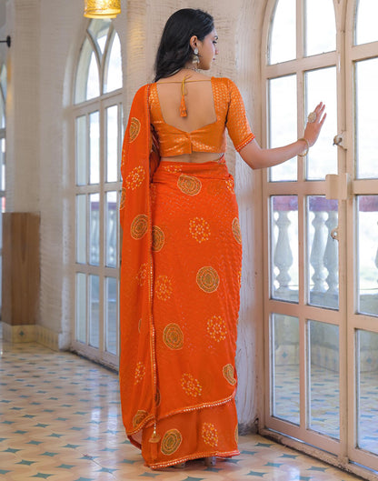 Orange Georgette Bandhani Printed Lace Saree