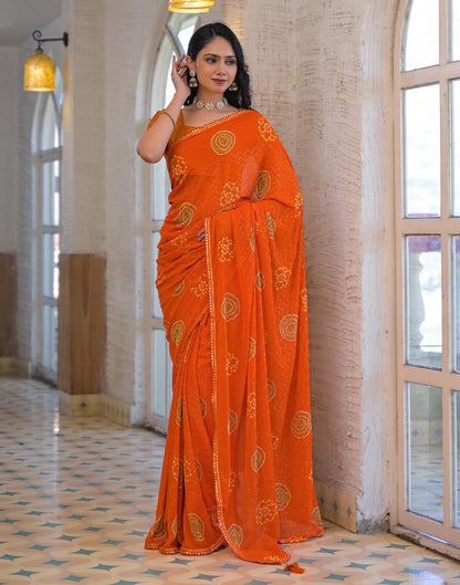 Orange Georgette Bandhani Printed Lace Saree