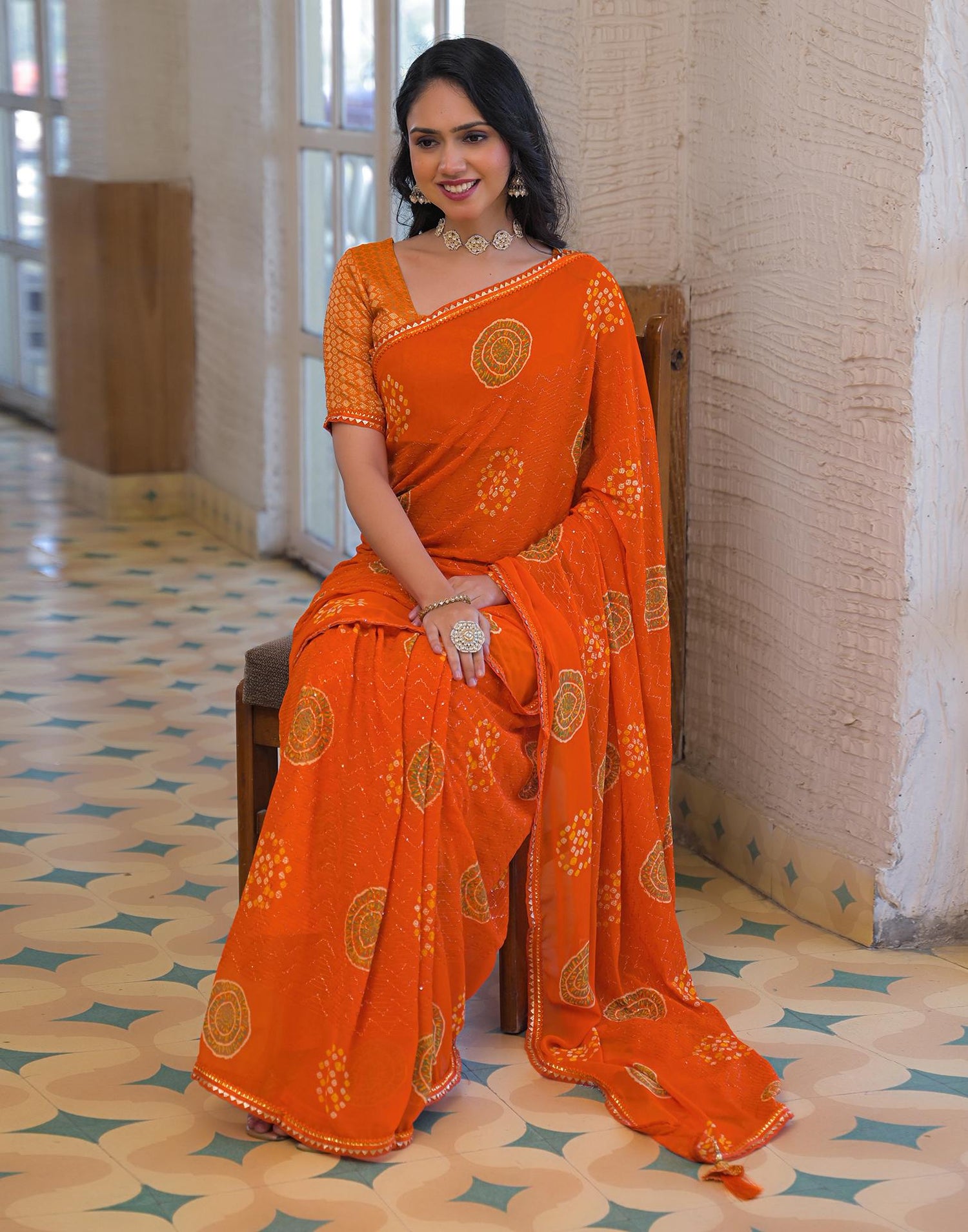 Orange Georgette Bandhani Printed Lace Saree