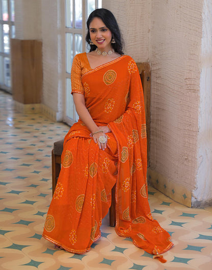 Orange Georgette Bandhani Printed Lace Saree