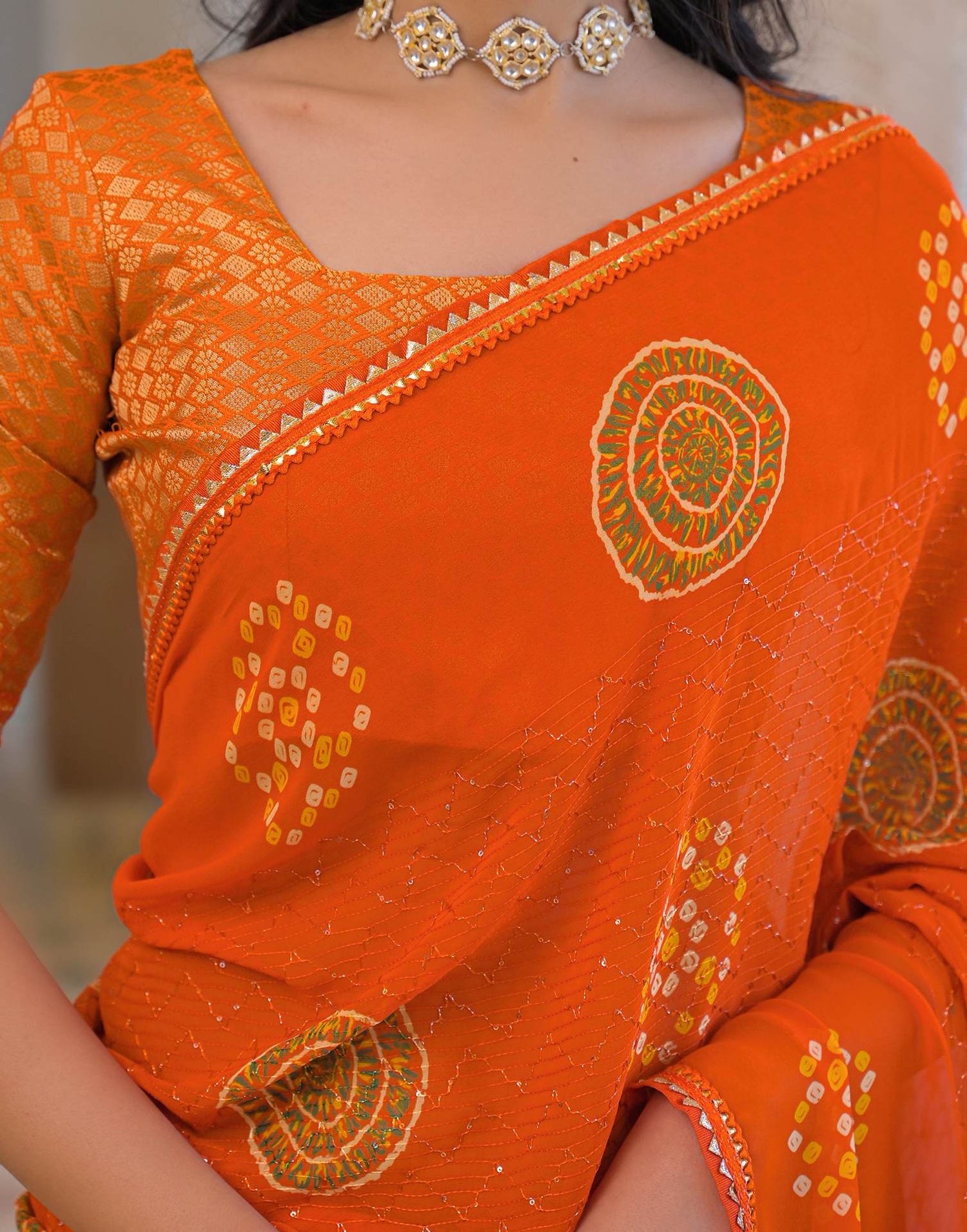 Orange Georgette Bandhani Printed Lace Saree