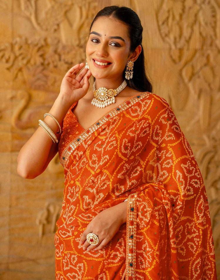 Orange Chiffon Bandhani Printed Lace Saree