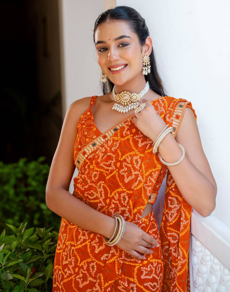 Orange Chiffon Bandhani Printed Lace Saree