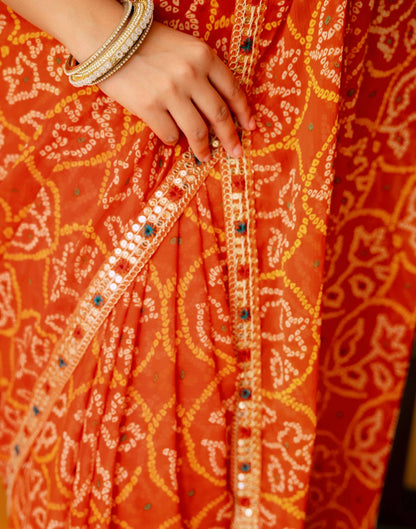 Orange Chiffon Bandhani Printed Lace Saree