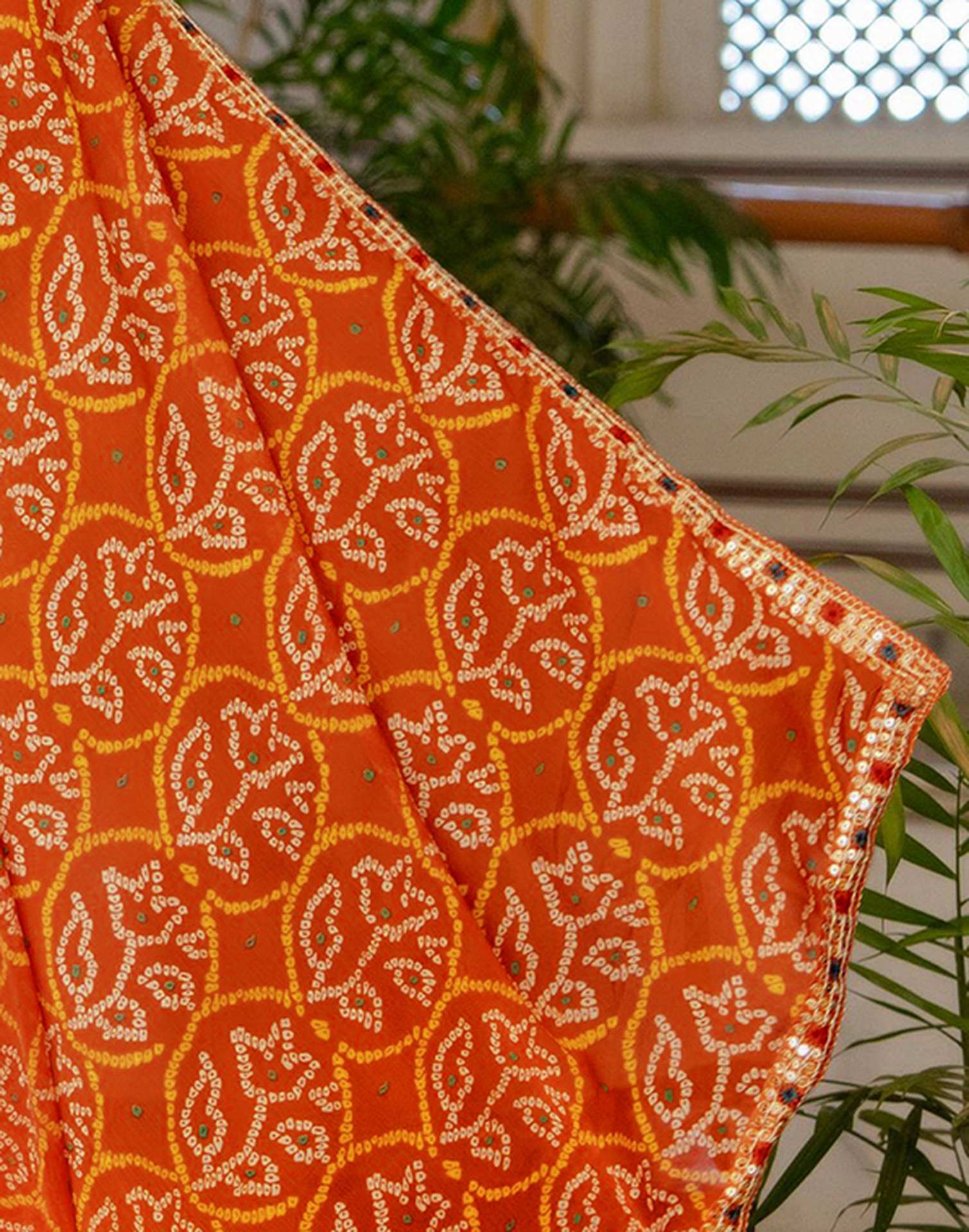Orange Chiffon Bandhani Printed Lace Saree