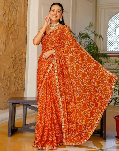 Orange Chiffon Bandhani Printed Lace Saree